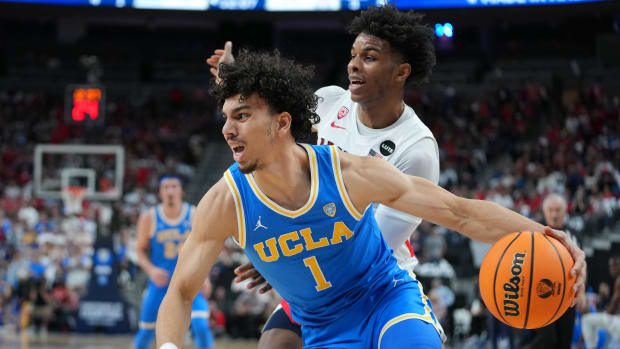 UCLA Bruins guard Jules Bernard (1) dribbles behind Arizona Wildcats guard Justin Kier (5) during the first half at T-Mobile Arena.